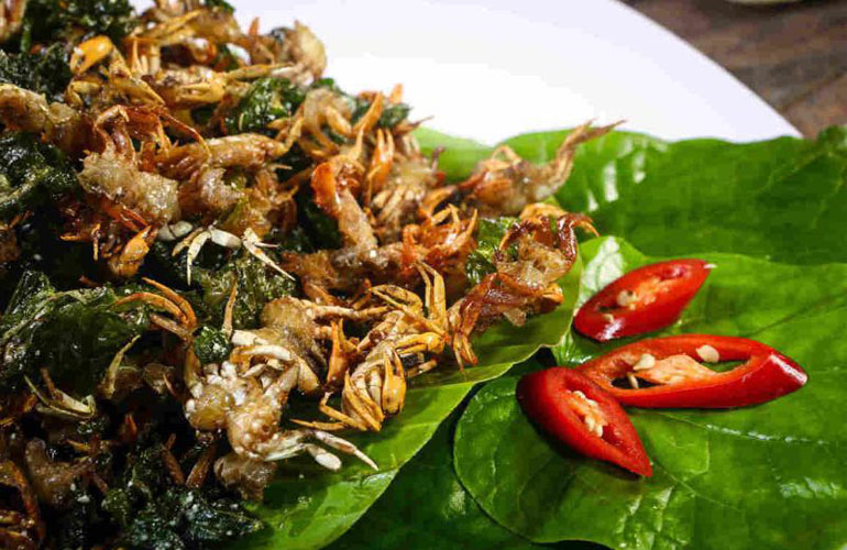 Rice Field crabs are roasted in wild betel leaves